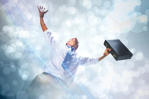 Businessman holding briefcase and cheering — Stock Photo, Image