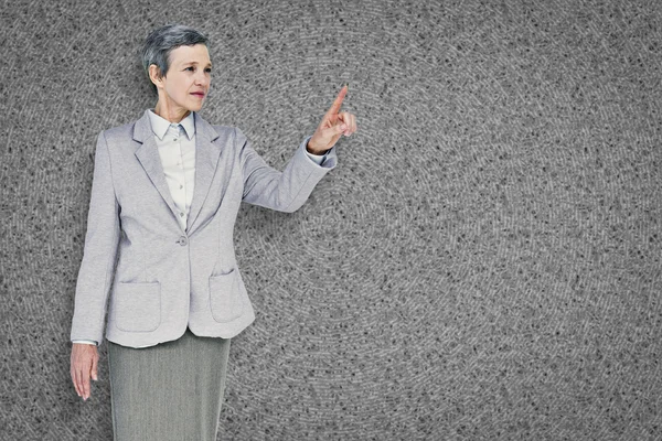 Composite image of businesswoman pointing — Stock Photo, Image