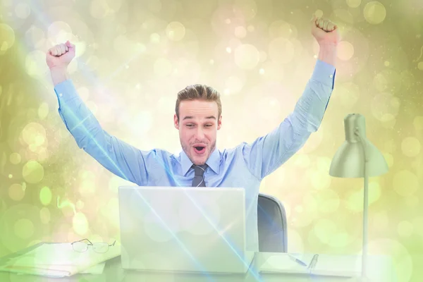 Cheering businessman at laptop — Stock Photo, Image