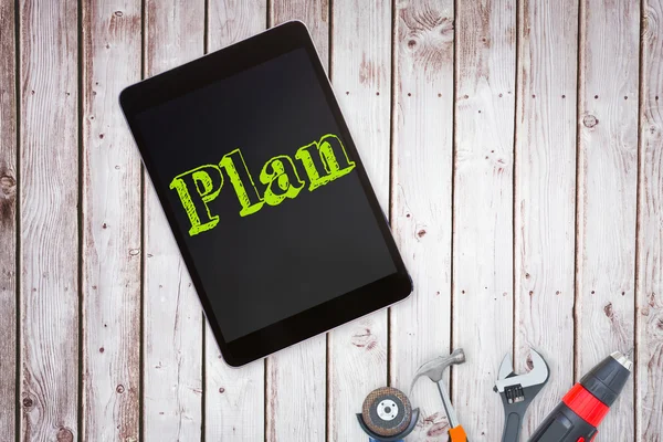 Plan against tools and tablet — Stock Photo, Image