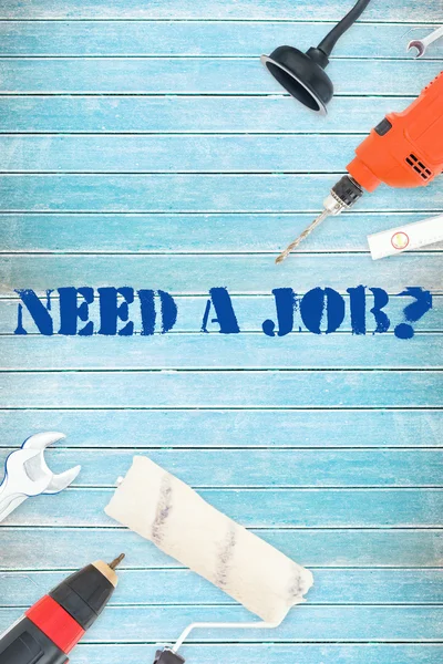 Need a job? against tools on wooden background — Stock Photo, Image