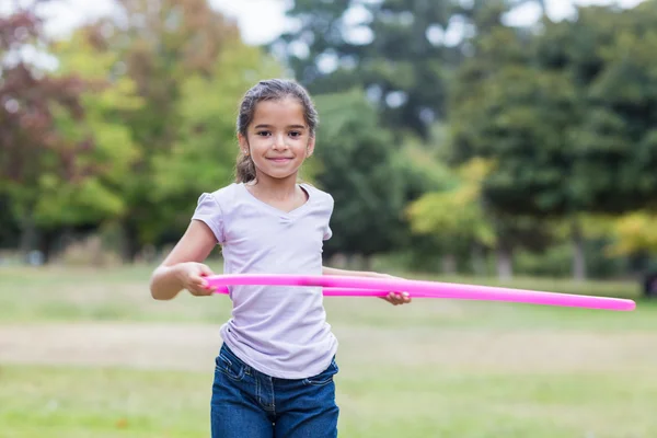 Happy girl playing with hula hoops — Φωτογραφία Αρχείου