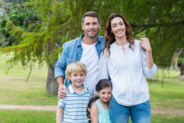 Happy family in the park together — Stock Photo, Image
