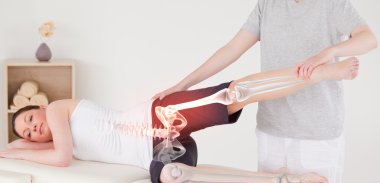 Highlighted bones of woman at physiotherapist  clipart