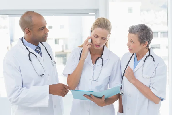 Doctors having an important phone call — Stock Photo, Image