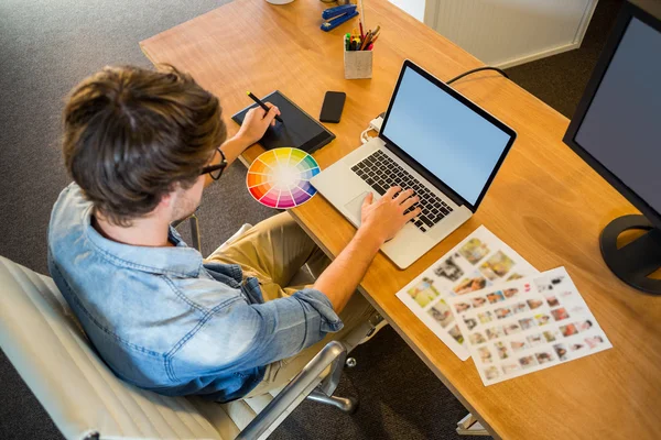 Designer working with colour wheel and digitizer — Stock Photo, Image