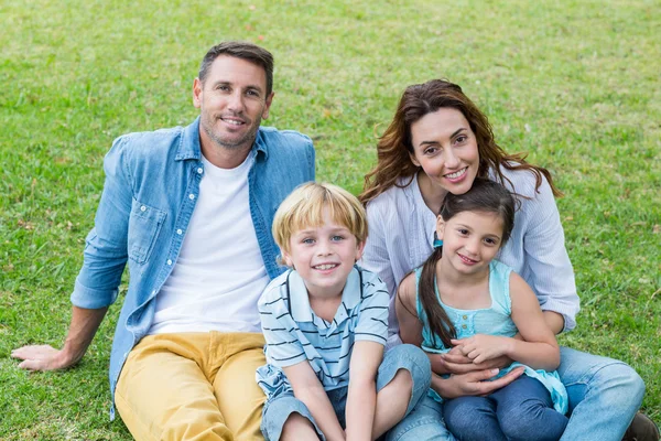 Happy family in the park together — Stock Photo, Image