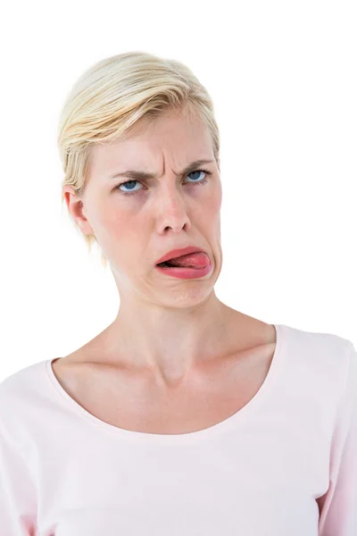 Blonde woman sticking her tongue out — Stock Photo, Image