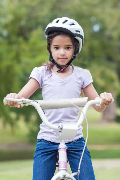 Little girl using her bike — Stok fotoğraf