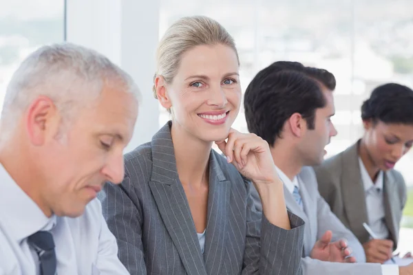 Business team taking notes during conference — Stock Photo, Image