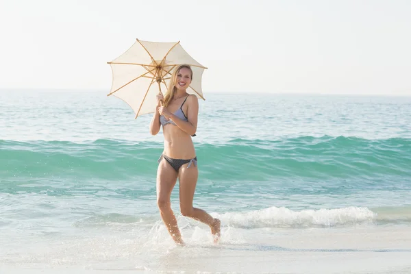 Blonde woman on sunny day at beach — Stok fotoğraf