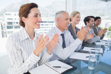 Business team applauding during conference clipart