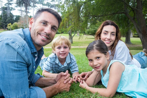 Happy family in the park together — Stock Photo, Image