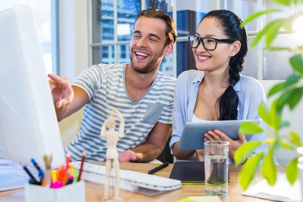 Smiling partners working together — Stockfoto