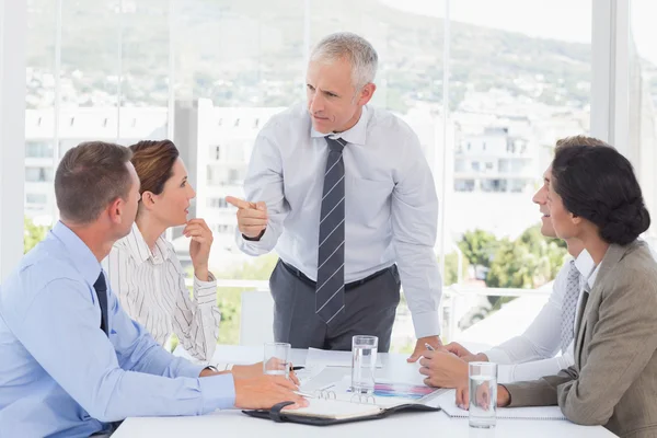 Businessman talking to his team — Stock Photo, Image