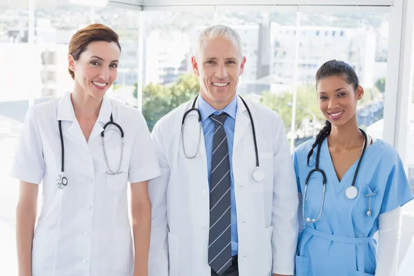 Smiling doctors looking at camera — Stock Photo, Image