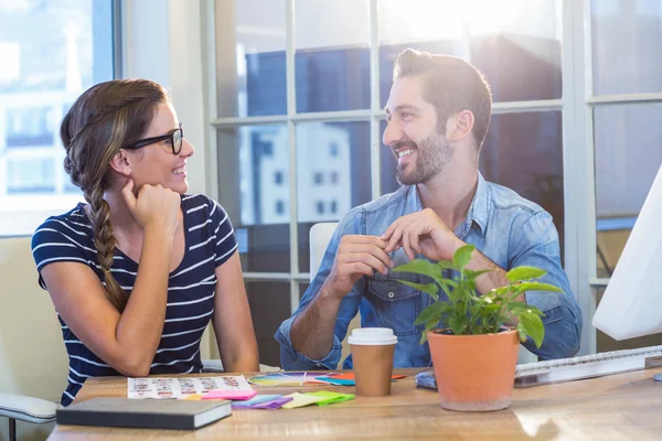 Smiling colleagues talking together — Stock Photo, Image