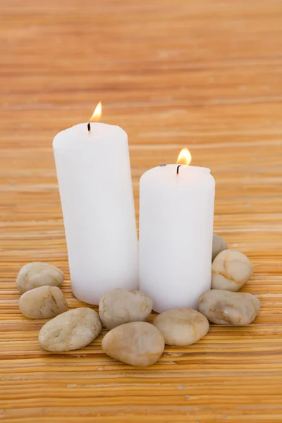 Candles with pebbles — Stock fotografie