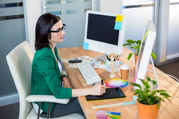 Designer working with colour wheel and digitizer — Stock Photo, Image