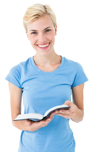 Blonde woman holding biblea — Stockfoto