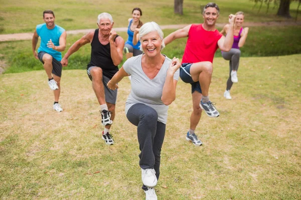 Happy athletic group training — Stock Photo, Image