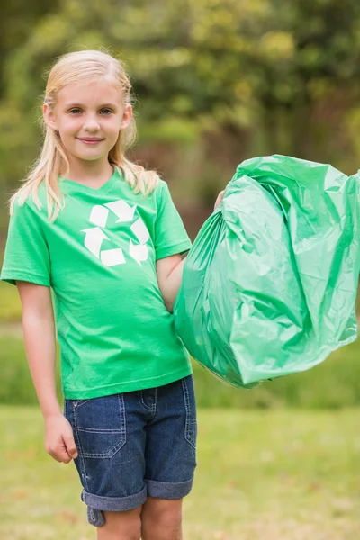 Happy little girl collecting rubbish — Stock Photo, Image