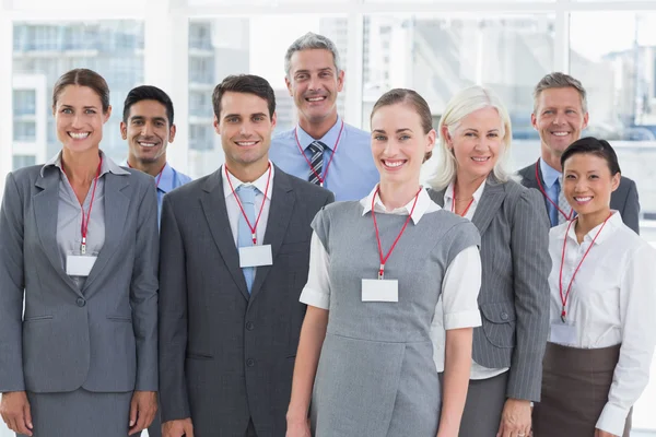 Happy business people looking at camera — Stock Photo, Image