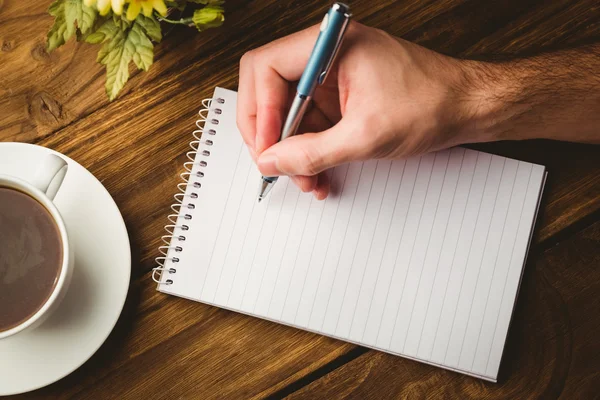 Hand schrijven over het Kladblok — Stockfoto