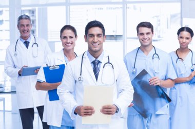 Portrait of confident doctors with arms crossed clipart