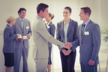 Business people shaking hands  clipart