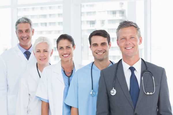 Portrait of confident doctors in row — Stock Photo, Image