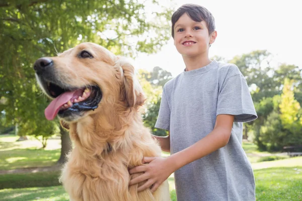 Little boy with his dog in the park — Stock Photo, Image