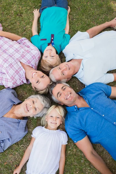 Happy family looking up camera — Stock Photo, Image