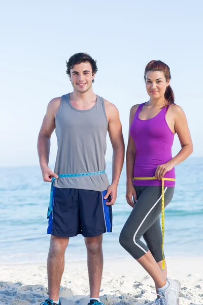 Couple measuring their waist — Stock Photo, Image