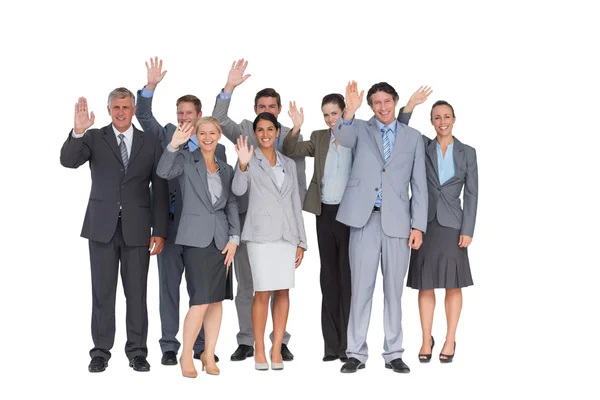 Sorridente team di lavoro che saluta la fotocamera — Foto Stock