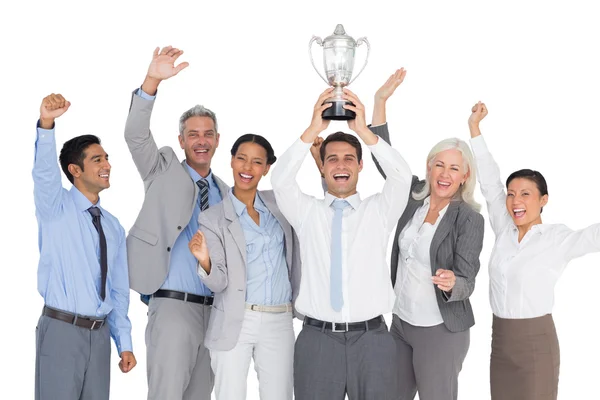 Business people holding cup and cheering — Stock Photo, Image