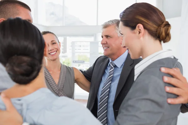 Business team standing in circle — Stock Photo, Image