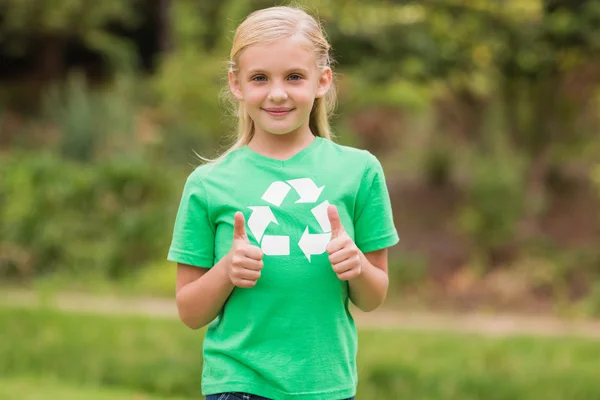 Happy little girl in green with thumbs up — Stock Photo, Image