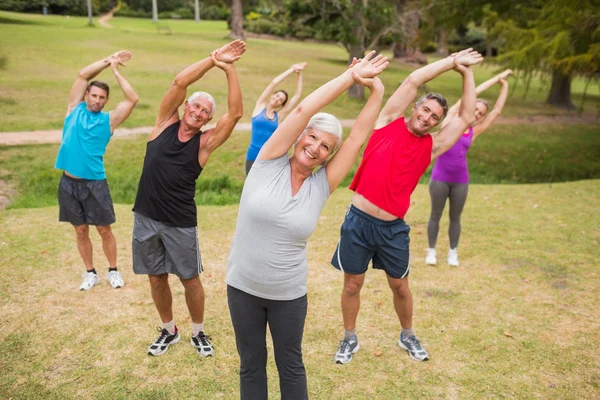 Happy athletic group training — Stock Photo, Image