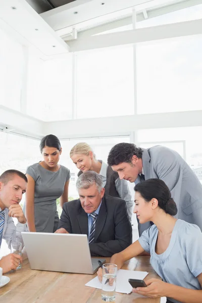 Concentrated business team working on laptop — Stock Photo, Image