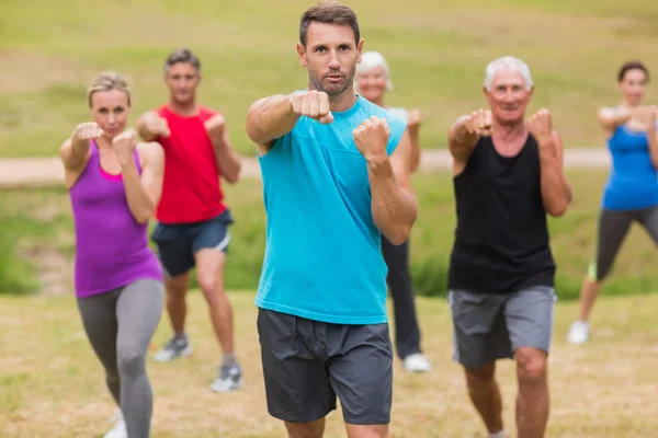 Athletic group showing their fists — Stock Photo, Image