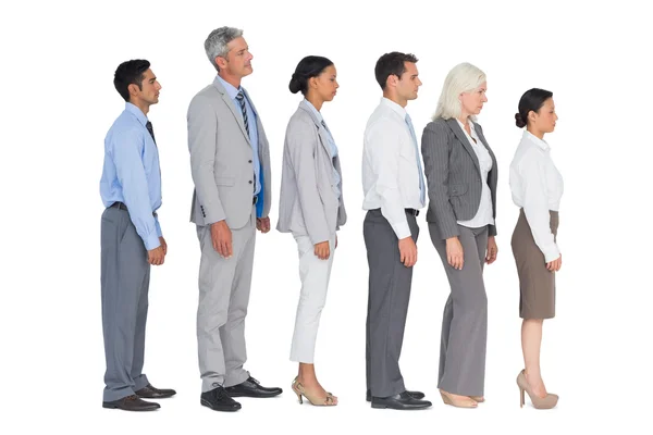 Business people standing behind other Stock Image