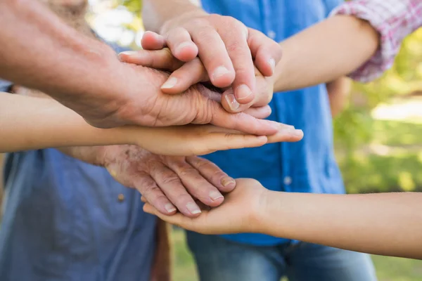 Family putting their hands together — Stock Photo, Image