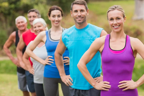 Happy athletic group smiling at camera — Stock Photo, Image