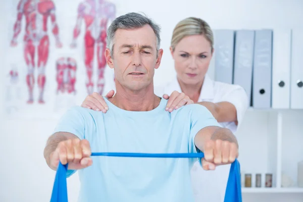 Doctor examining her patient back — Stock Photo, Image