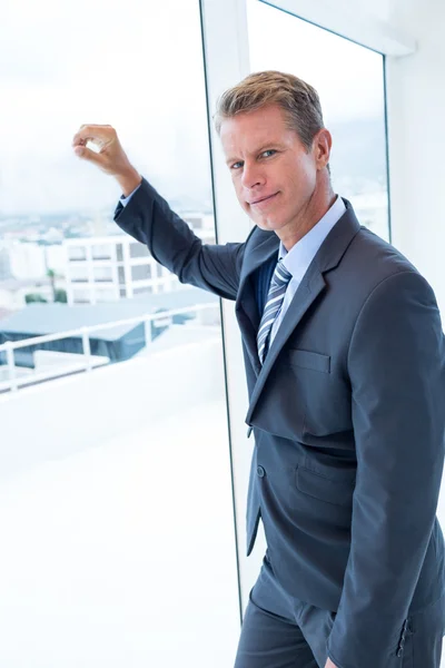 Businessman looking out the window — Stock Photo, Image