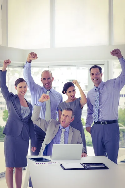 Business team having a meeting and cheering — Stock Photo, Image