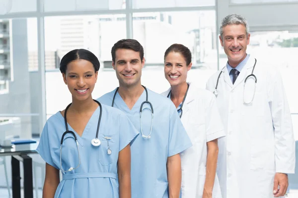 Portrait of confident doctors in row — Stock Photo, Image