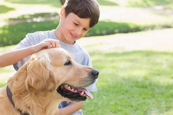 Little boy with his dog in the park — Stock Photo, Image