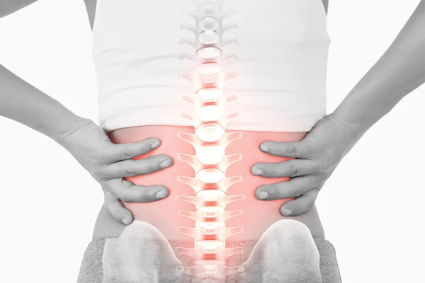 Highlighted spine of woman with back pain — Stock Photo, Image